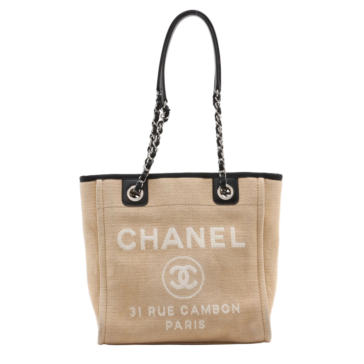 Beige Chanel Deauville PM handbag with black chain strap on a white background