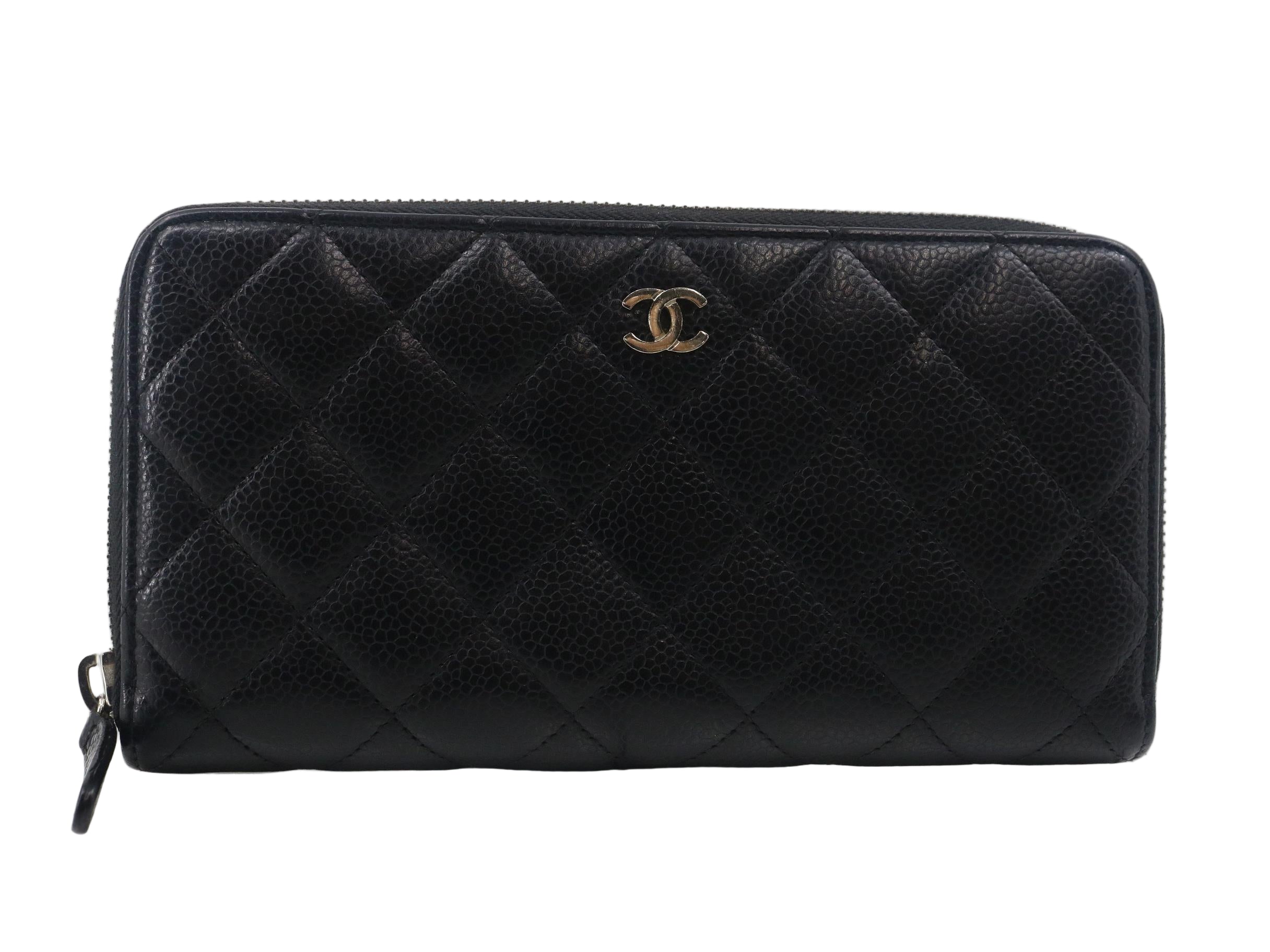 Chanel Black quilted wallet with Chanel logo on a white background
