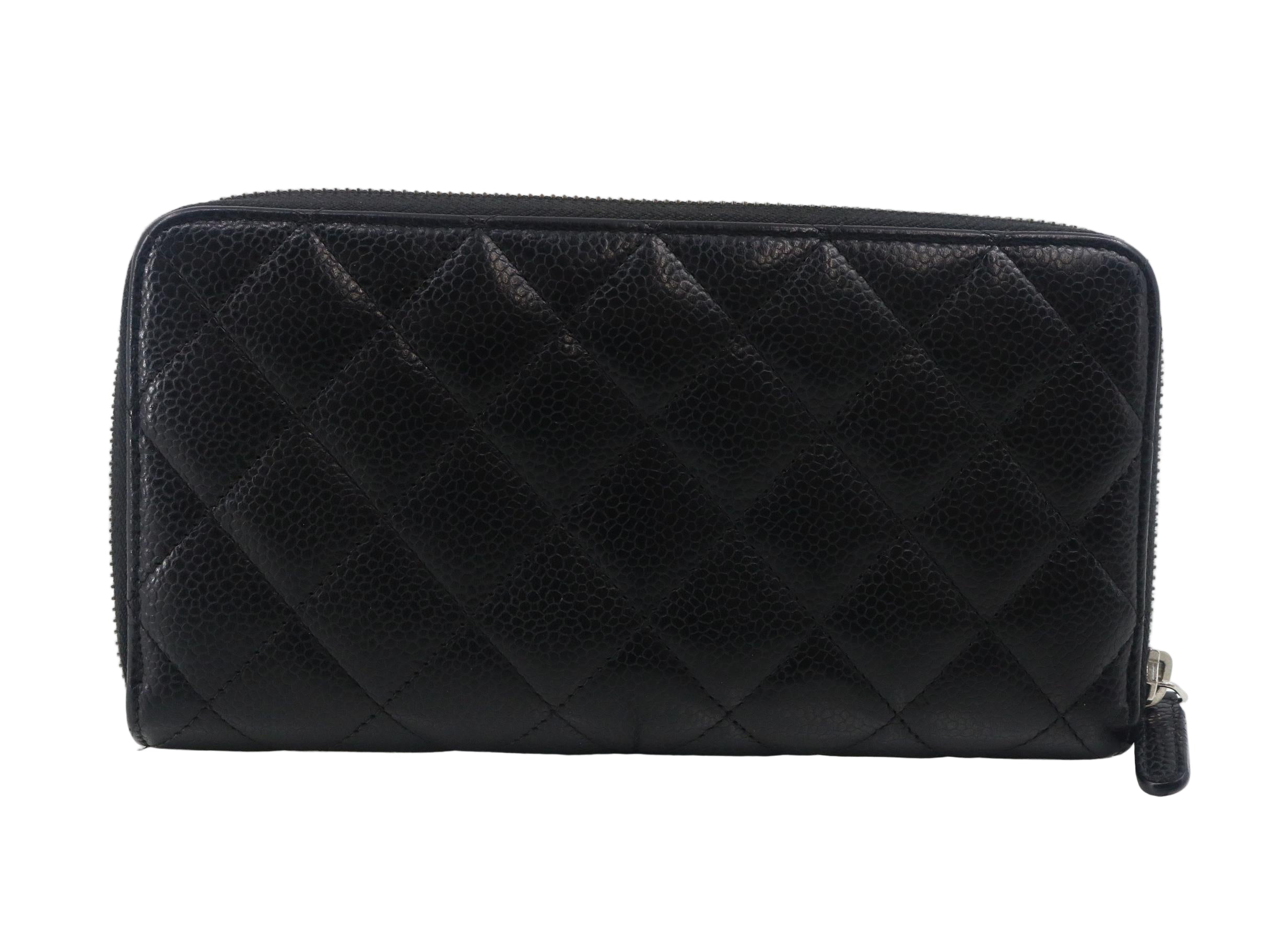 Chanel Black quilted wallet on a white background