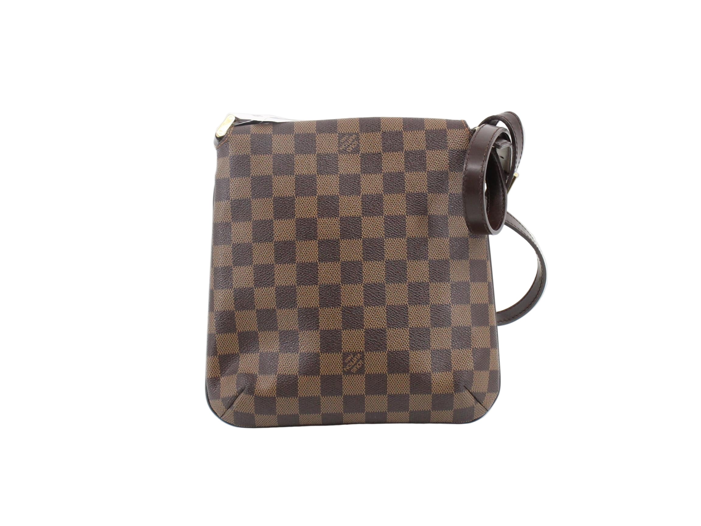 Brown checkered handbag on a white background