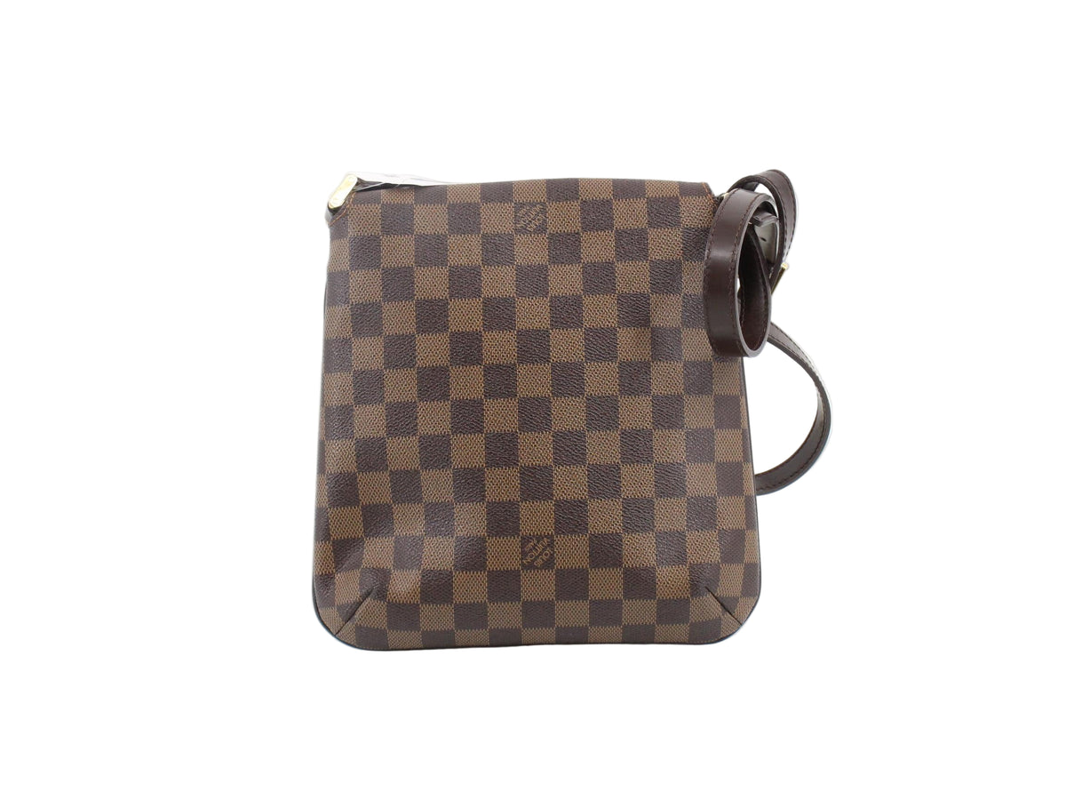Brown checkered handbag on a white background