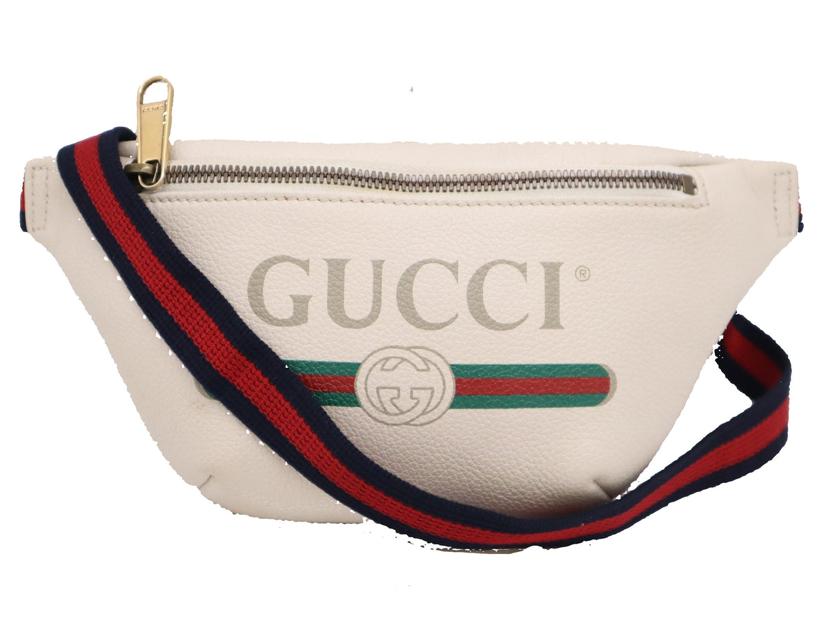 Gucci waist bag with red and blue strap on a white background