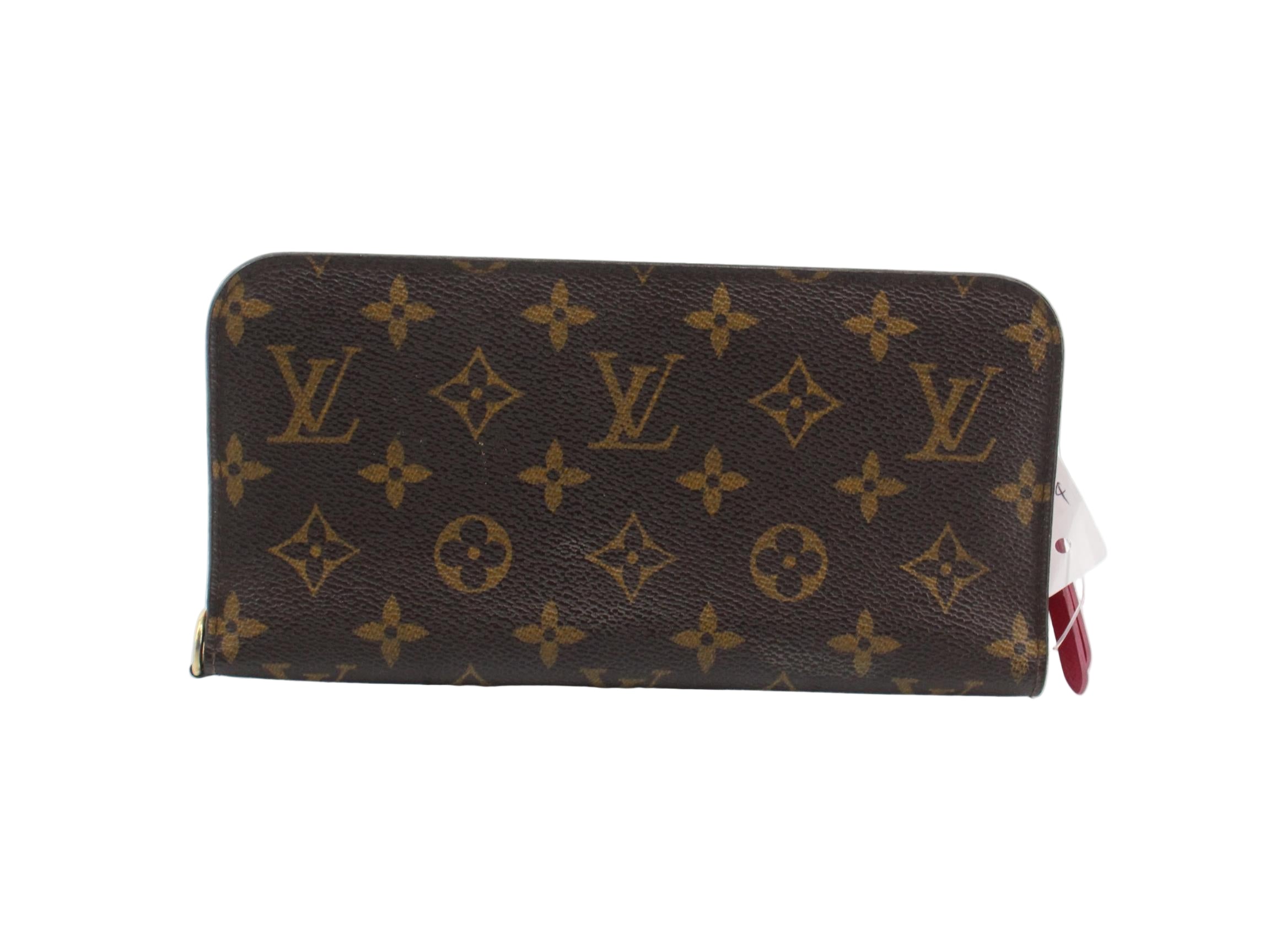 Louis Vuitton Insolite wallet with monogram pattern on a white background