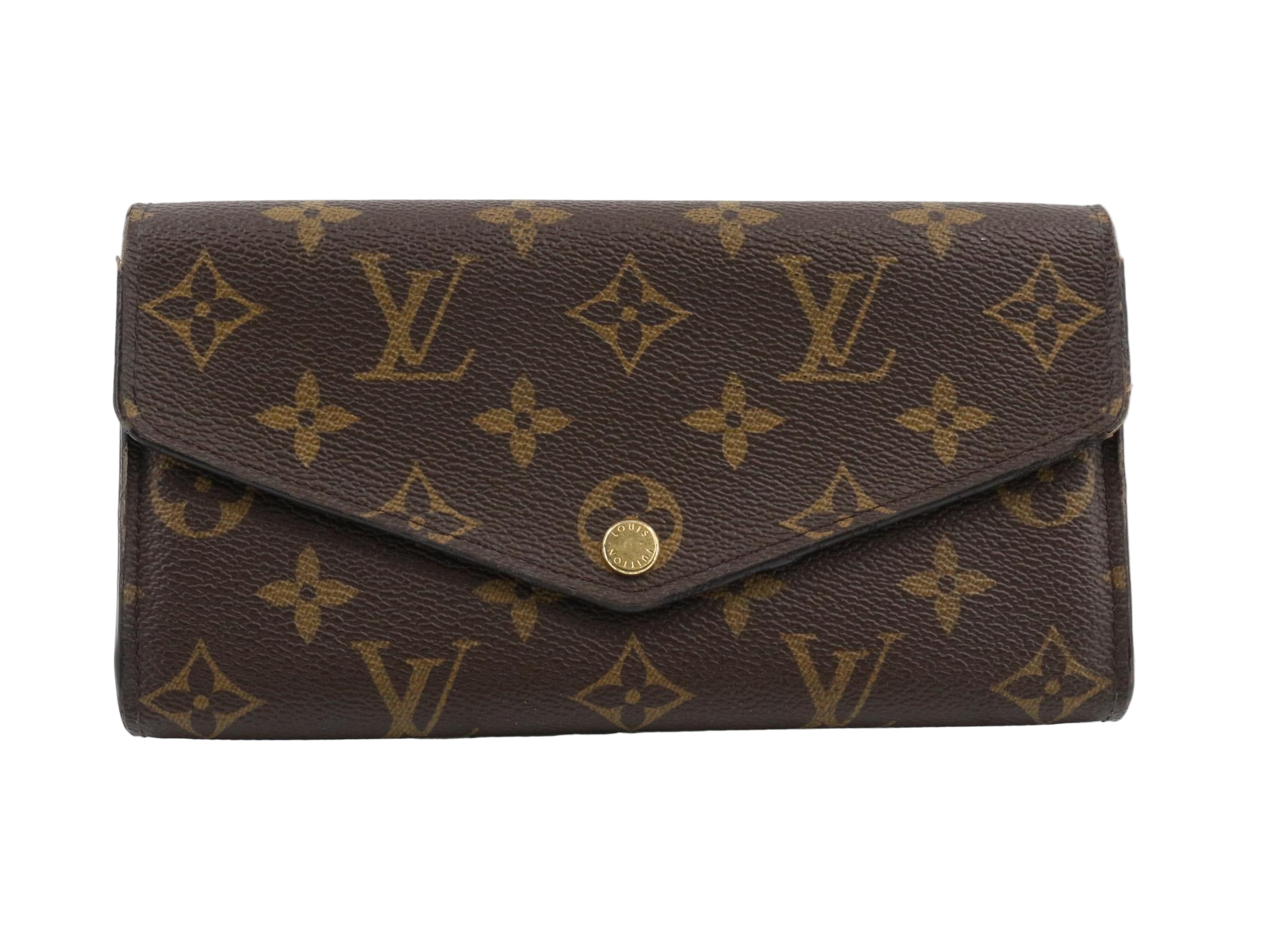 Louis VUitton Sarah NM Brown wallet with gold monogram pattern on a white background
