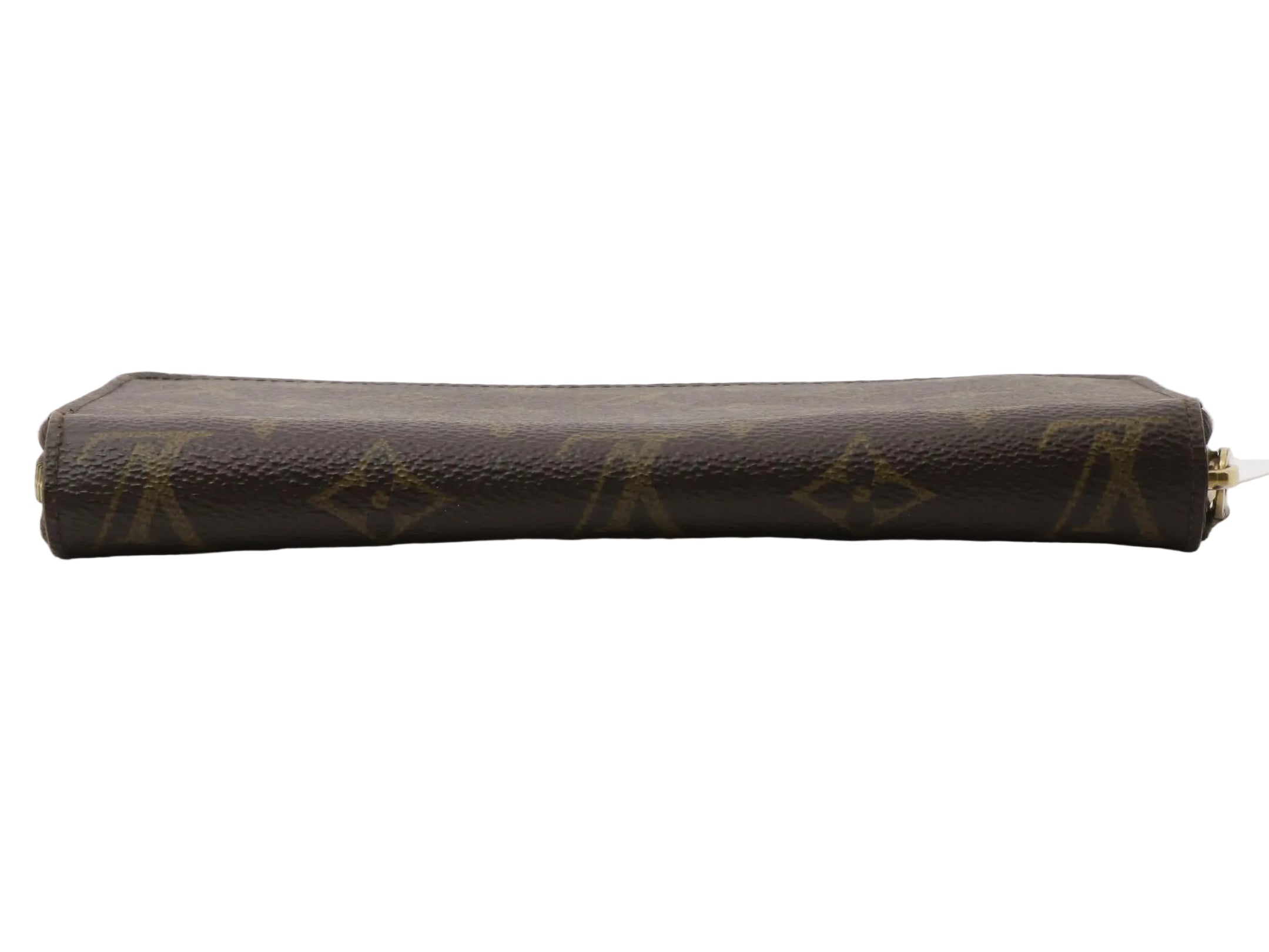 A Louis Vuitton monogram canvas zip-around pouch in dark brown with gold-tone hardware, shown horizontally on a light gray reflective surface.