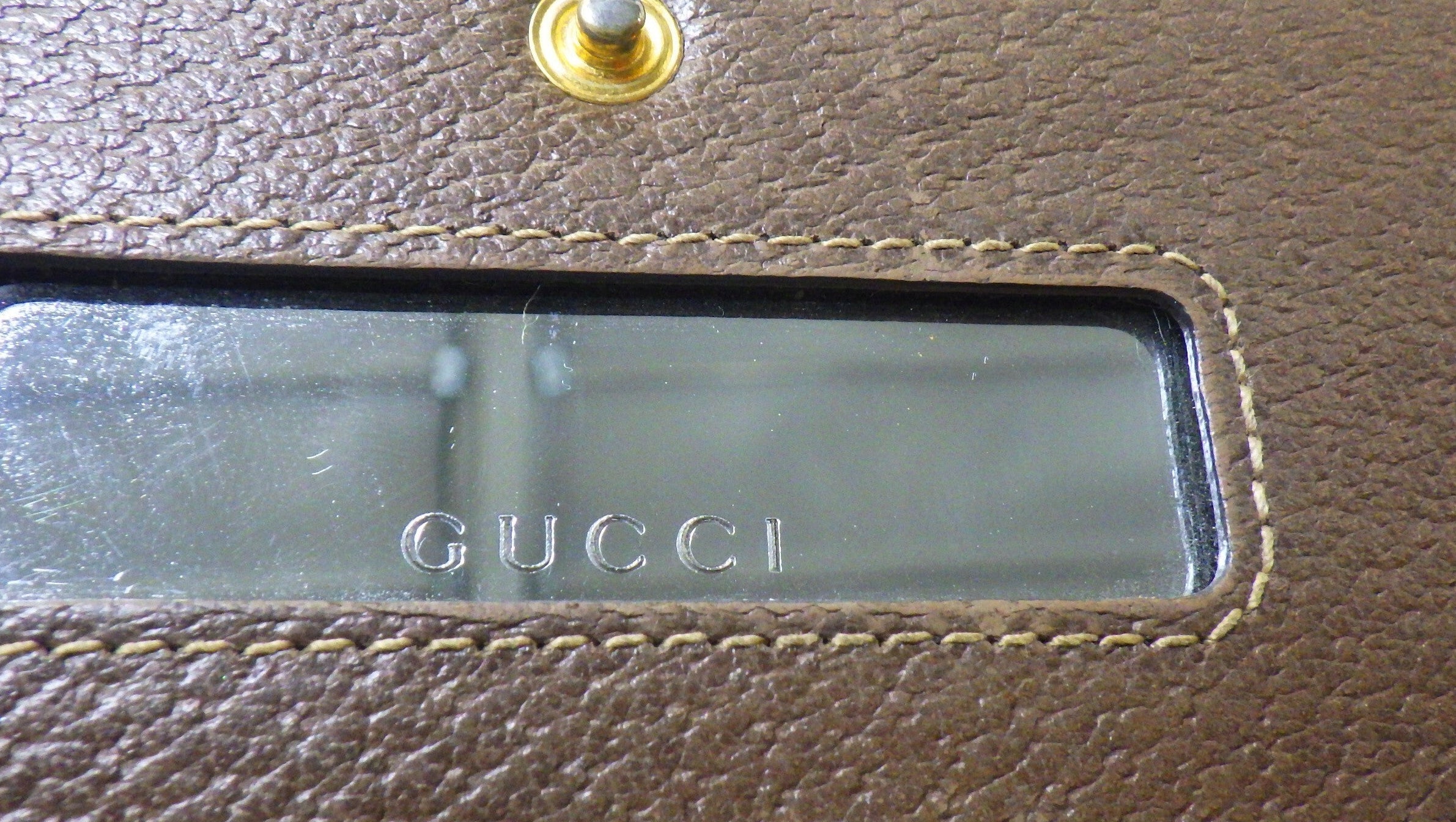 Close-up of a Gucci handbag with visible brand logo.